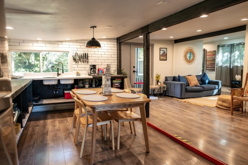 Wide view of the open kitchen, dining, and living room